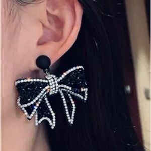 Glitzy Black and Silver Large Bow Fashion Earrings adorned Rhinestone Crystals.